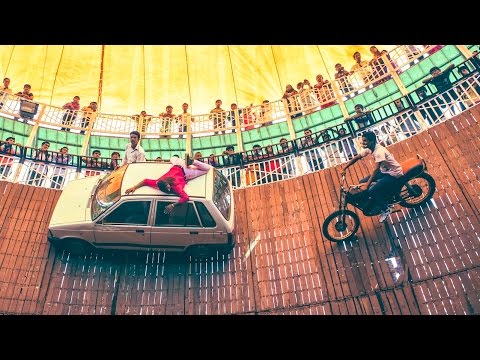 Vehicles Ride At High Speed On Walls In The "Well Of Death"