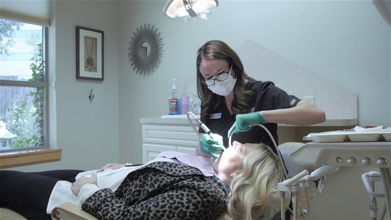 Oklahoma City dental team member treating a patient