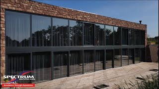 Drone footage of an amazing "Paragraph 79" self-build home recessed into the bank of a rural lake.