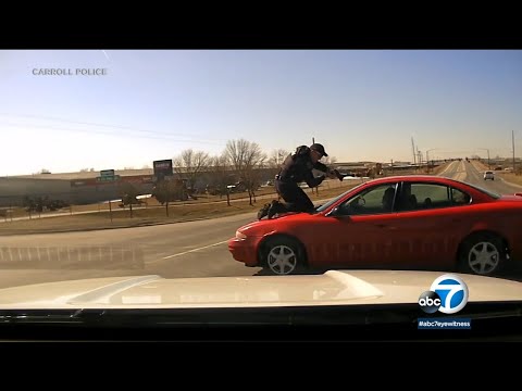 Video shows police officer holding on to fleeing car before ejection