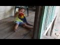 Miskito Girl And Scarlet Macaw Play Together