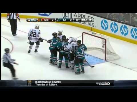 Andrew Desjardins hipchecks Duncan Keith