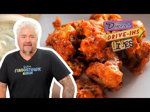 Guy Fieri Eats Buffalo Cauliflower Wings | Diners, Drive-Ins and Dives | Food Network