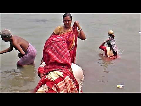 people are river bathing in the Ganges on holy occasion