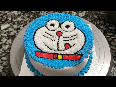 Doramon cake designe /pink and white /1 pound cake
