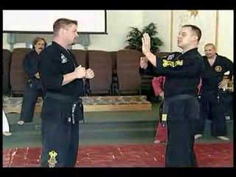 Master Drew Serrano teaching a block