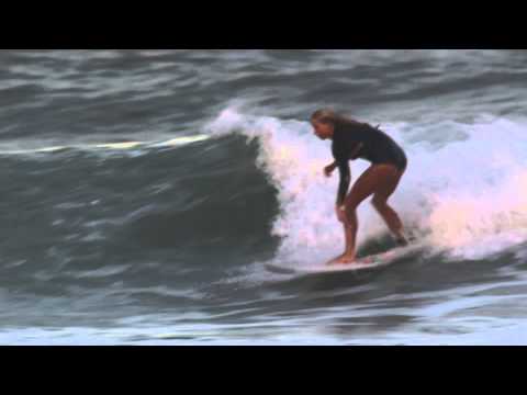 Macy Callaghan surfing