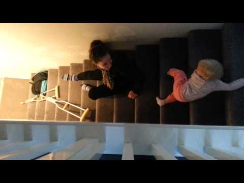 Teaching my big sis to slide down the stairs.