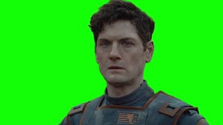 Syril Karn stares into the distance shocked after an explosion — Andor green screen
