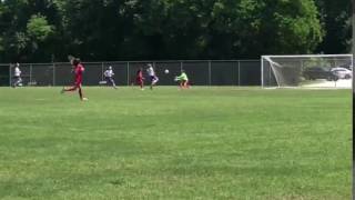 Goalkeeper catches ball and knee