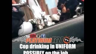 Cop drinking in uniform possibly on the job