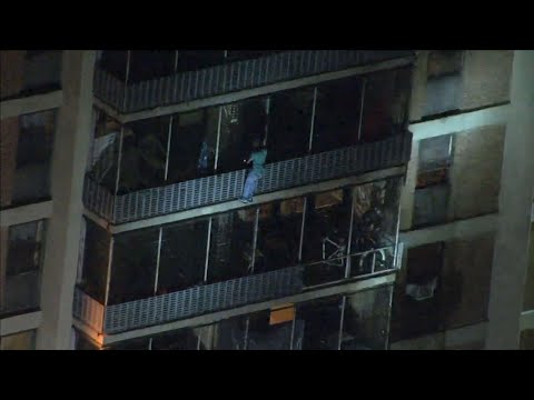Video from the WPVI-TV helicopter in Philadelphia shows a man scaling down the side of a high rise building during a fire on Thursday night. (July 19)