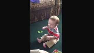 Mortimer laughing at ripping paper