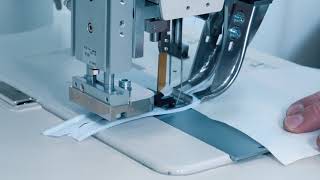 Automated workstation for sewing a zipper from a roll while cutting the center of the fabric EWS 9987 ASS video