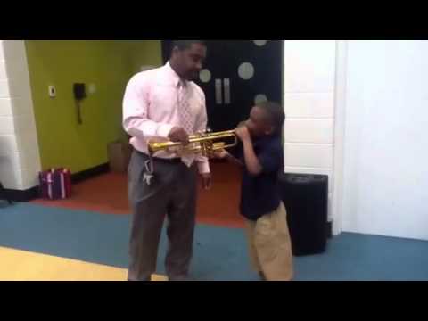 Mr. McKinney educates on the trumpet
