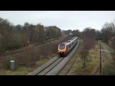 Eastbound Avanti West Coast train passes the old Holywell Junction station Flintshire Wales 20.3.21