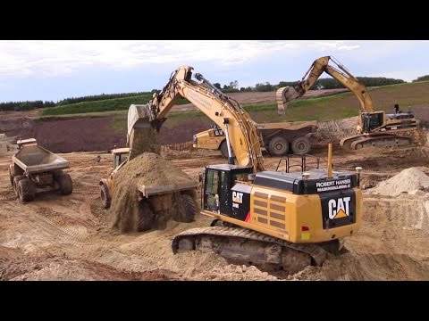 Cat 349e and cat 345b excavator loading dumpers