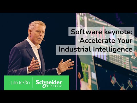 A group of people standing in front of a green and yellow arch