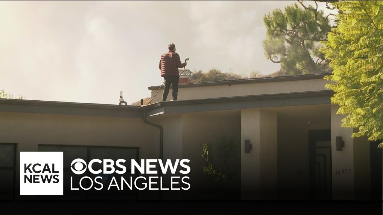 Encino man hoses down his home as Palisades Fire burns