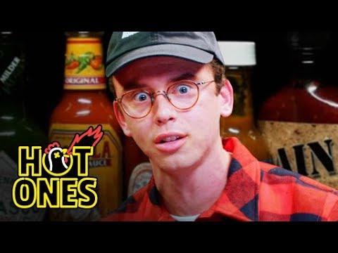 Logic Solves a Rubik's Cube While Eating Spicy Wings | Hot Ones Video