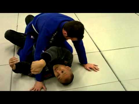 BJJ Breakdown: How to Do the Buck and Roll Escape from Mount