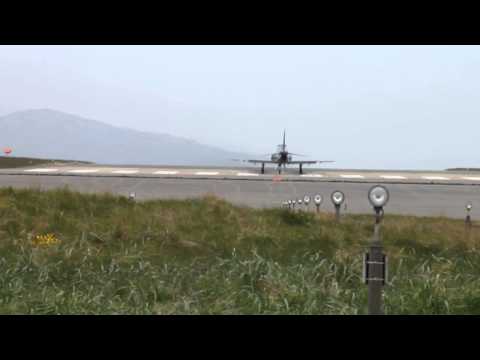 Hawk Airplane taking off with three others lining up - RAF Valley