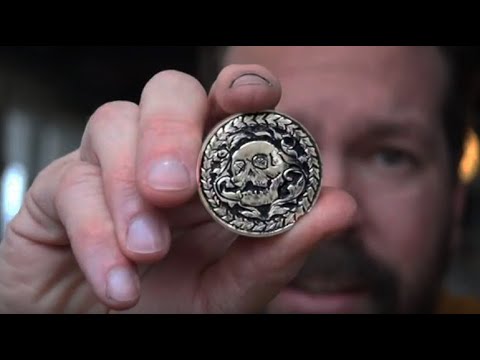 Hand Engraving A Bronze Skull