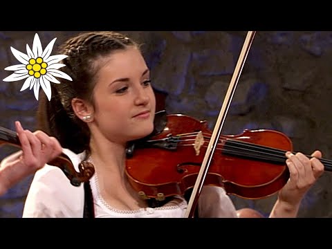 Short but smashing folk polka played by pretty girl trio and their family members