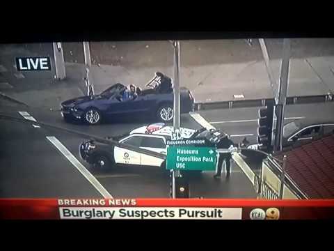 Police pursuit suspects in the rain