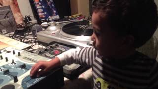 My Lil son   Practicing his hip-hop skills on the turntables