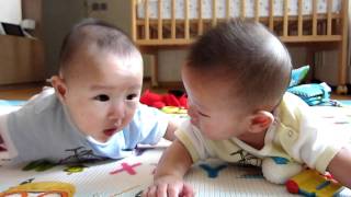 Happy Twin Babies Laughing at Mom's Coughing