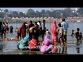Devotees Offer Prayers After Taking A Holy Bath In River Ganga