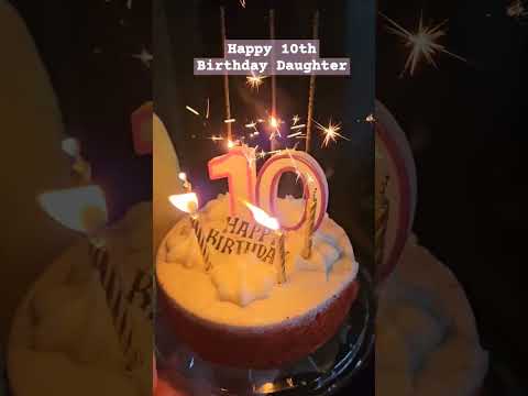 10th Birthday Cake & blowing of the candles.