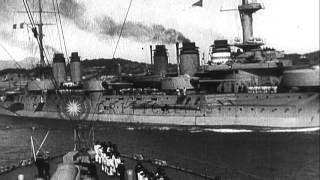 Smoke rises up from smokestack of ships and Italian boats patrol the Austrian coa...HD Stock Footage