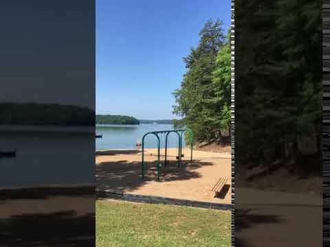 Beach area with playground, picnic shelters, bathrooms, dock
