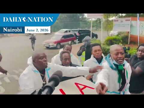 Activists protest against the US-Kenya Ebola deal outside Afya House