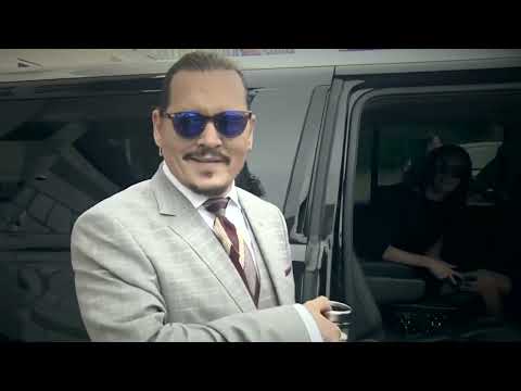 Johnny Depp leaving court today listening to Vanessa Paradis