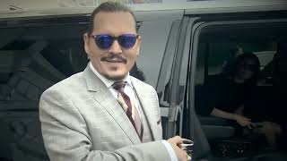 Johnny Depp leaving court today listening to Vanessa Paradis