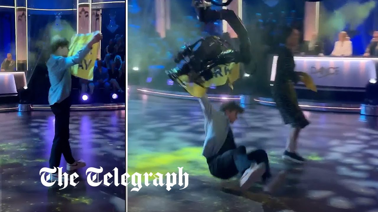 Watch: Eco activist hit by camera after storming Strictly dancefloor