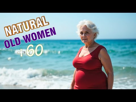 Donne mature naturali oltre i 50 anni - Stile anti-età: il collo asimmetrico: abito con stampa a ...