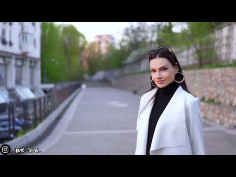 brunette girl in black pantyhose walks in high heels