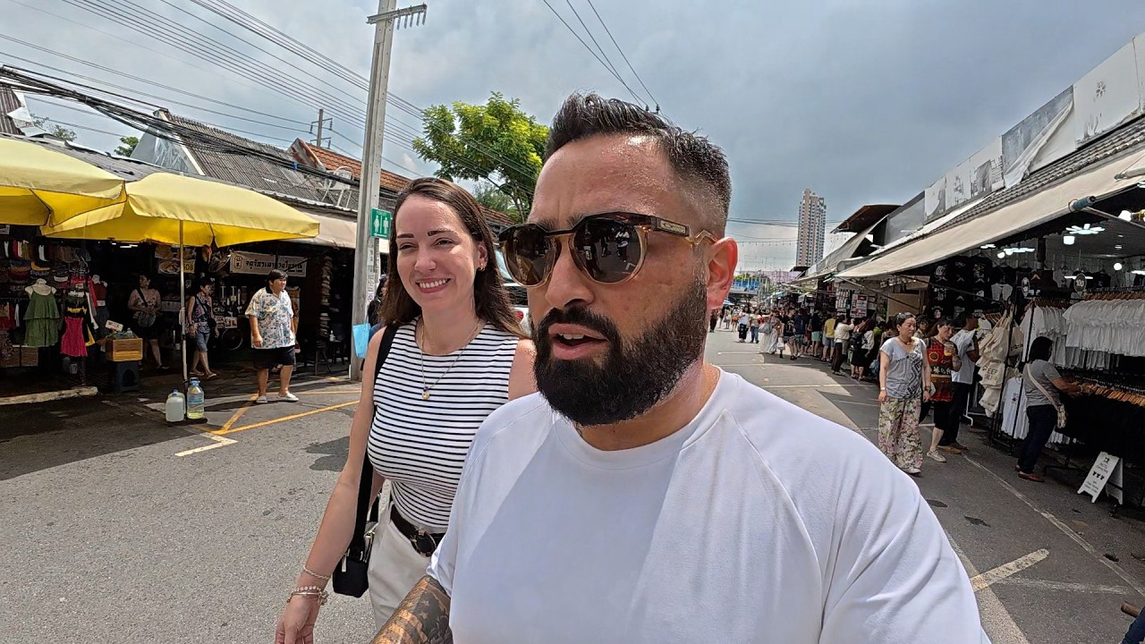 Join tourists as they delve into the vibrant hustle and bustle of Chatuchak Weekend Market.