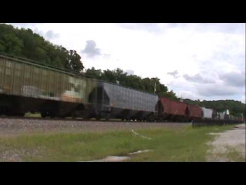 BNSF 5337 through parkville with SHAVE AND A HAIR CUT