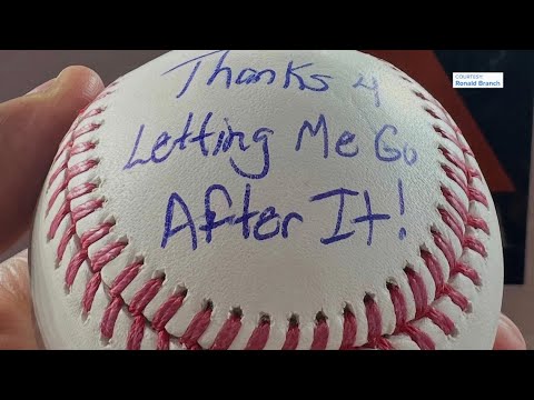 Rangers' Brandon Nimmo gives Astros fan a baseball with a message written on it