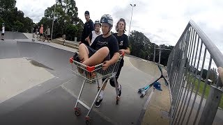 Kid Goes Down Ramp On Trolley