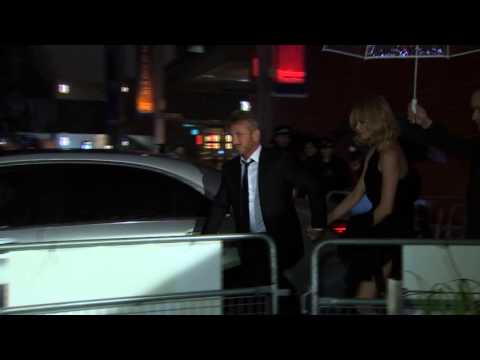 Charlize Theron and Sean Penn arrive at The Gunman premiere