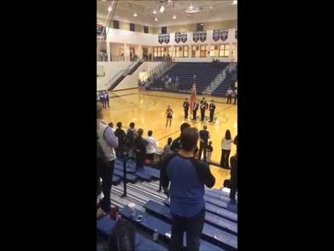 Saxon Olson singing the National Anthem