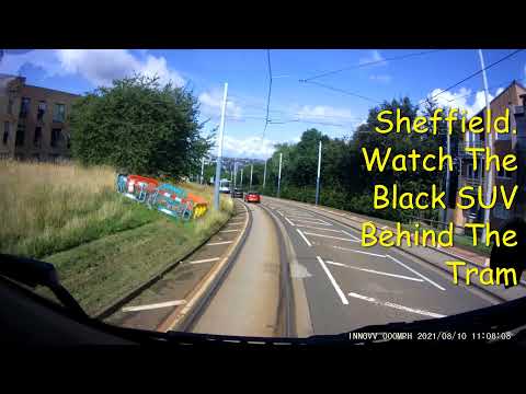 Sheffield. New SUV drives on to the Tram Tracks.
