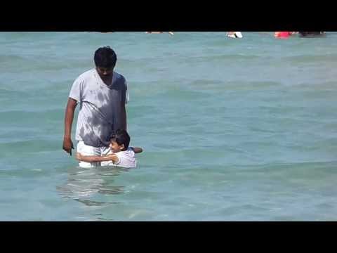 Leshanth with his dad in ADNOC Beach