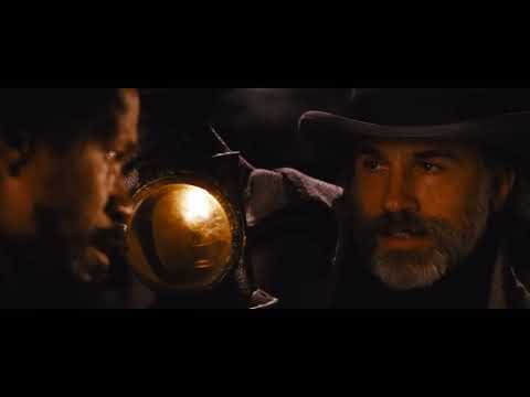 Django Unchained finale: mansion exterior lit by fire with silhouettes